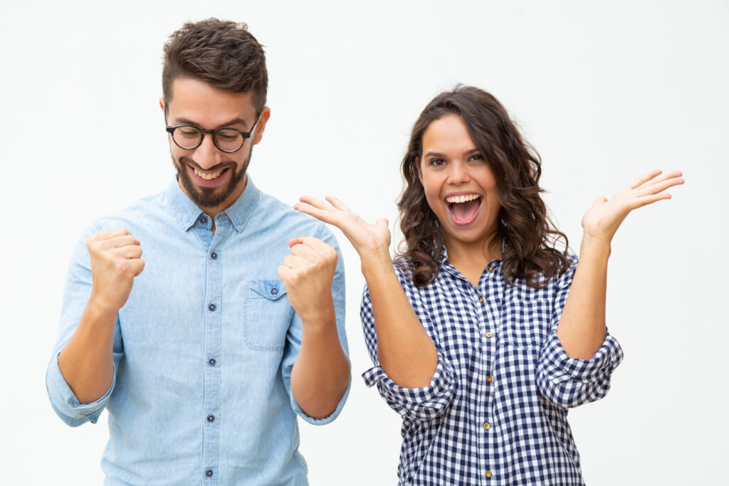 content young couple celebrating success